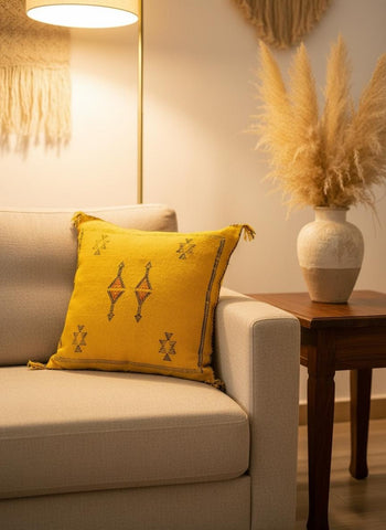 Artisan Sabra pillow styled on modern sofa