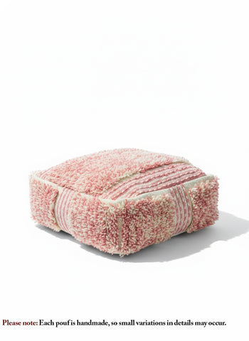 Handmade Moroccan wool pouf in pink and white displayed on a white backdrop.