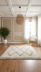 Berber Tifra rug in a neutral living room with rattan chair