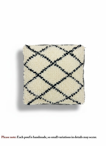 Top view of a handmade beige and black diamond-pattern Moroccan pouf.