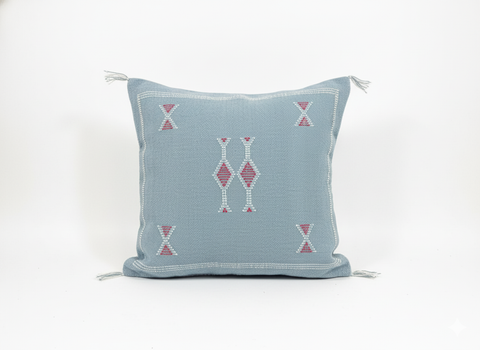 Studio shot of Tanina Berber pillow – light blue with pink geometric embroidery