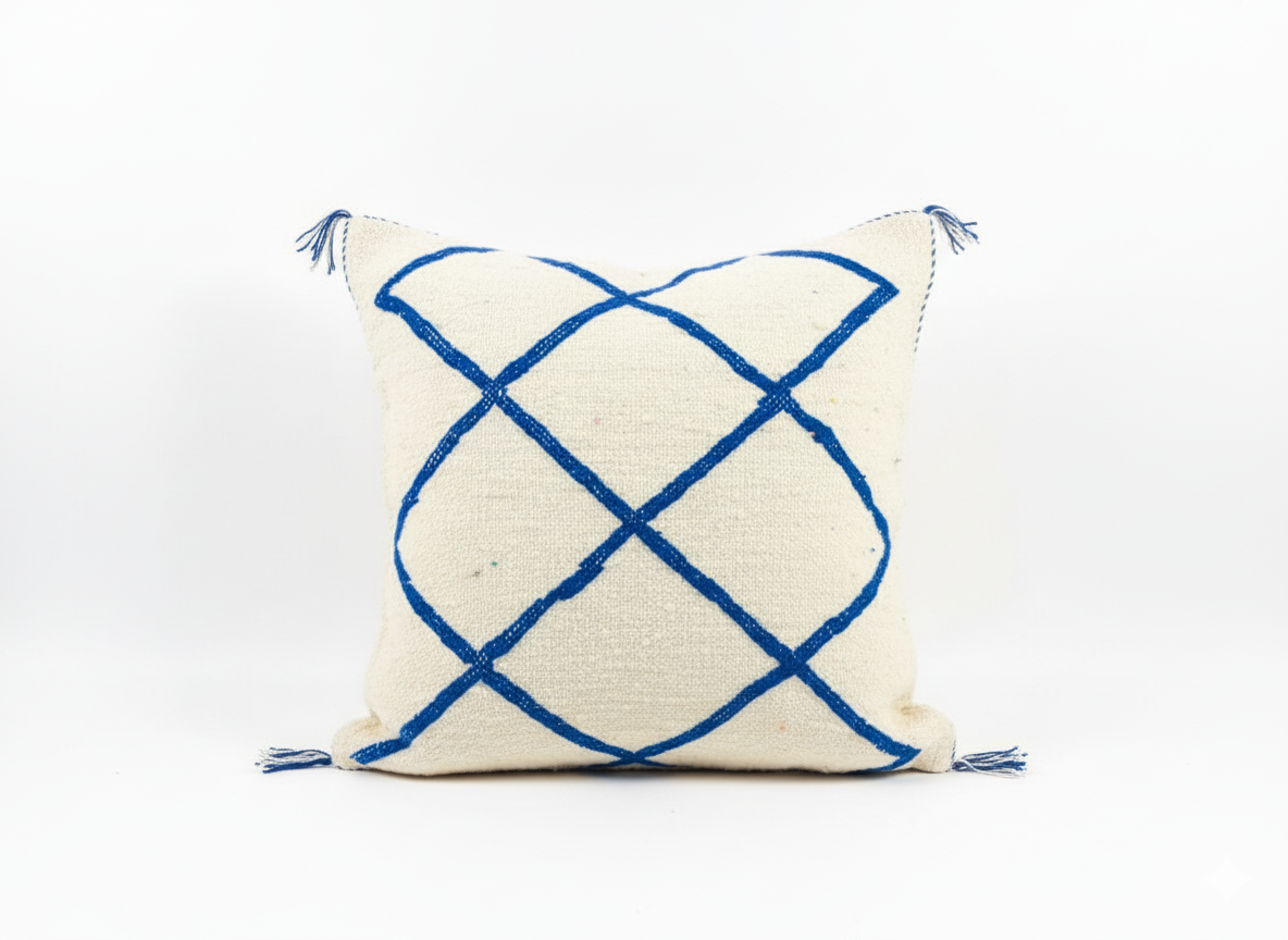 Flat Tinessa Moroccan cushion on cream rug with geometric lines