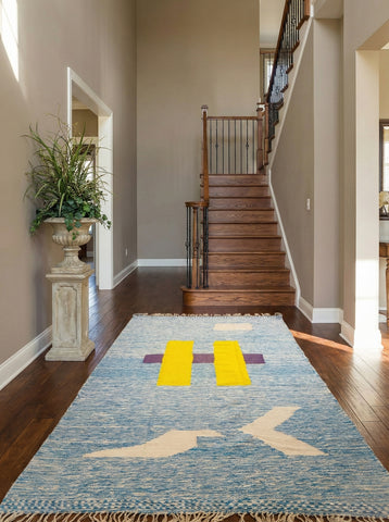 Tafida Moroccan rug with geometric motifs placed in a bright entryway.