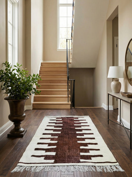 Moroccan Nara rug in modern entryway near staircase
