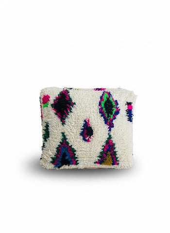 Moroccan wool pouf with vibrant geometric motifs