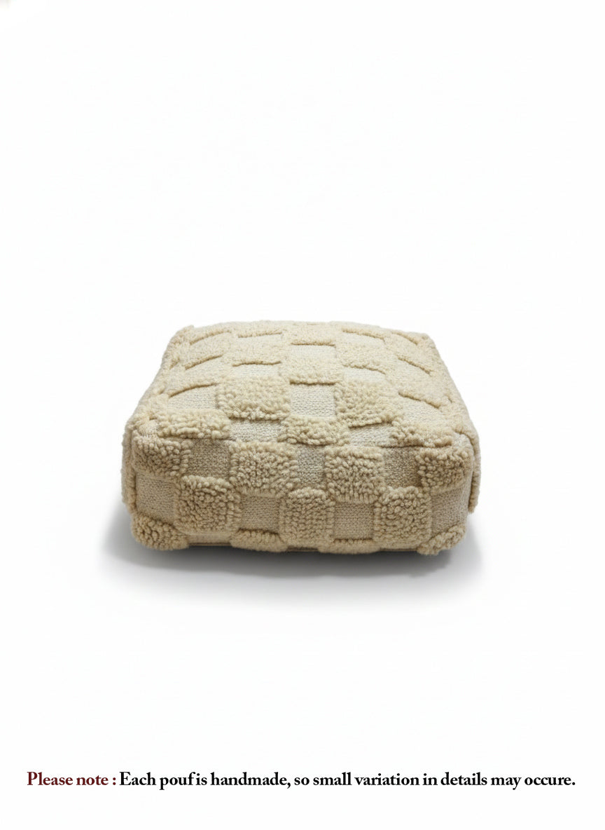 Beige Berber Azar pouf with textured wool pattern on white background