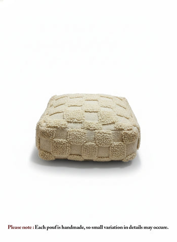 Beige Berber Azar pouf with textured wool pattern on white background