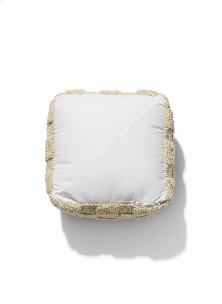 Top view of Berber Azar pouf showing soft handwoven wool texture
