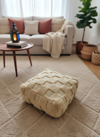 Moroccan Berber Azar pouf used as a cozy floor cushion in living room