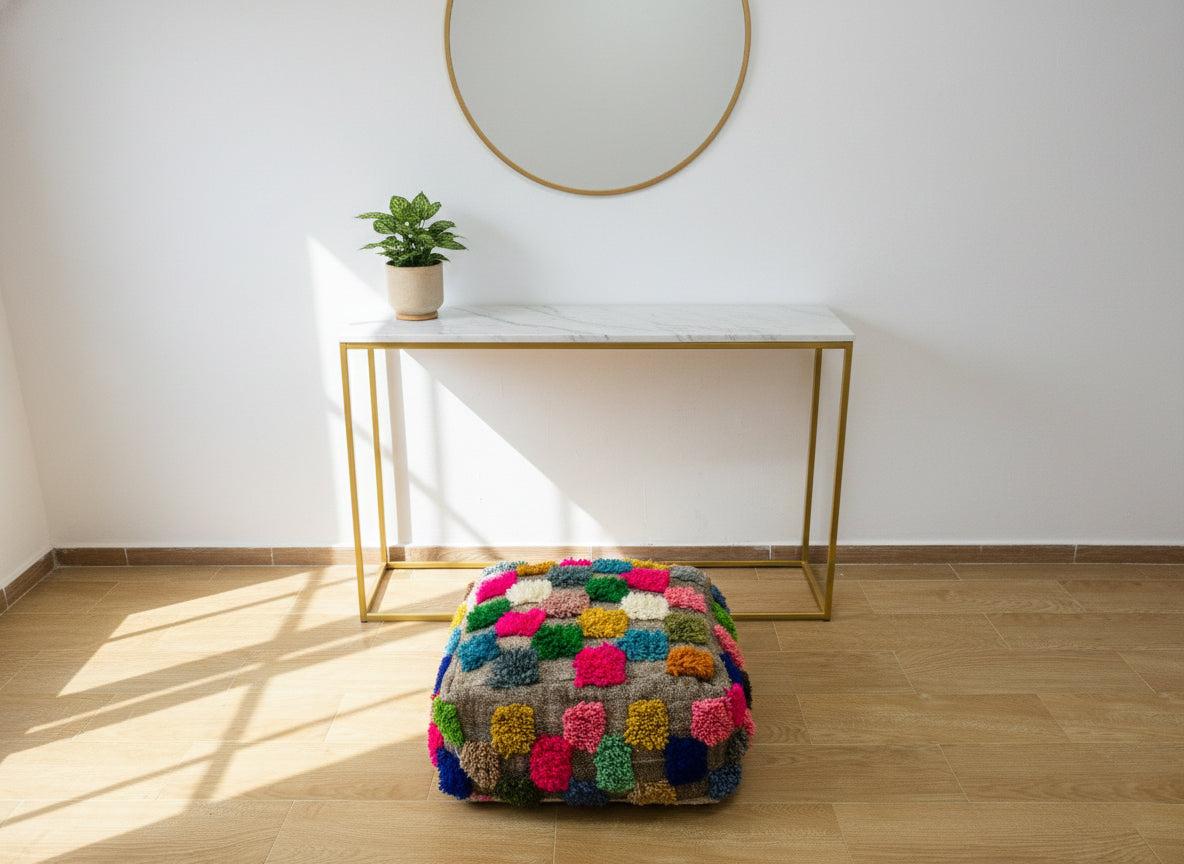 Colorful Berber pouffe displayed in a modern room with natural light.