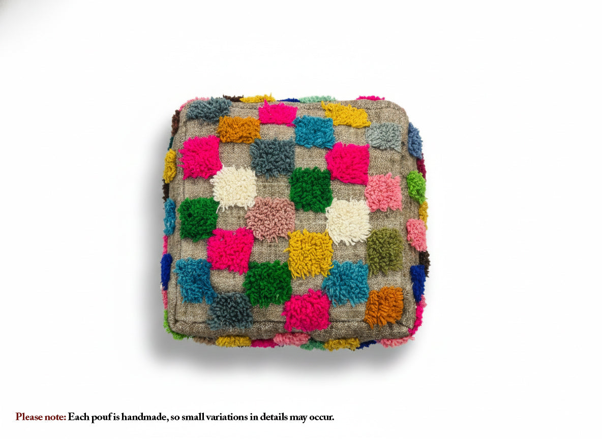 Top view of handmade Moroccan Ider pouffe with colorful wool squares.