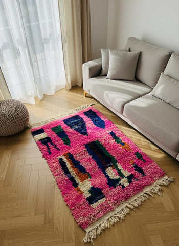 Pink Moroccan wool rug displayed upright