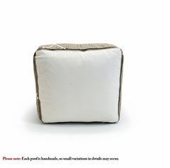 Handmade brown Berber wool pouf with white geometric lines, Moroccan floor cushion.