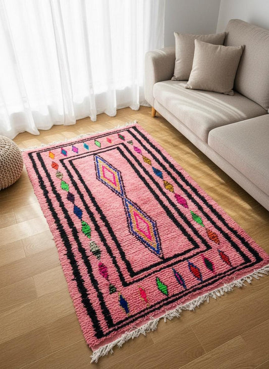 Pink Moroccan rug with colorful diamond pattern