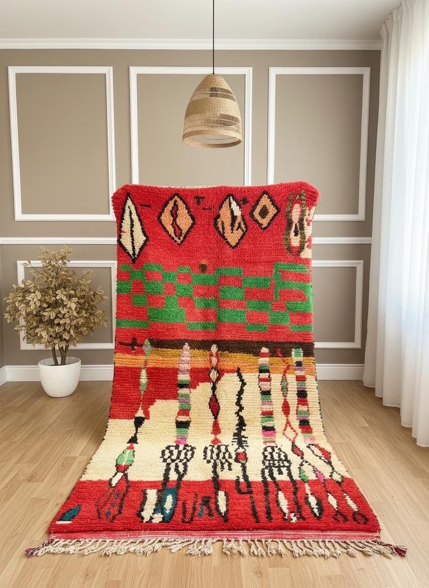 Colorful Moroccan rug with bold geometric pattern displayed upright.