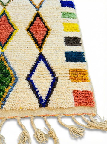 Close-up of wool Berber rug texture and diamond motifs
