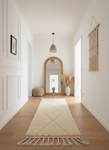 Beige Moroccan hallway runner rug with pink accents and tasseled fringe