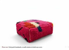 Side view of the handmade fuchsia Moroccan Mazin pouf.