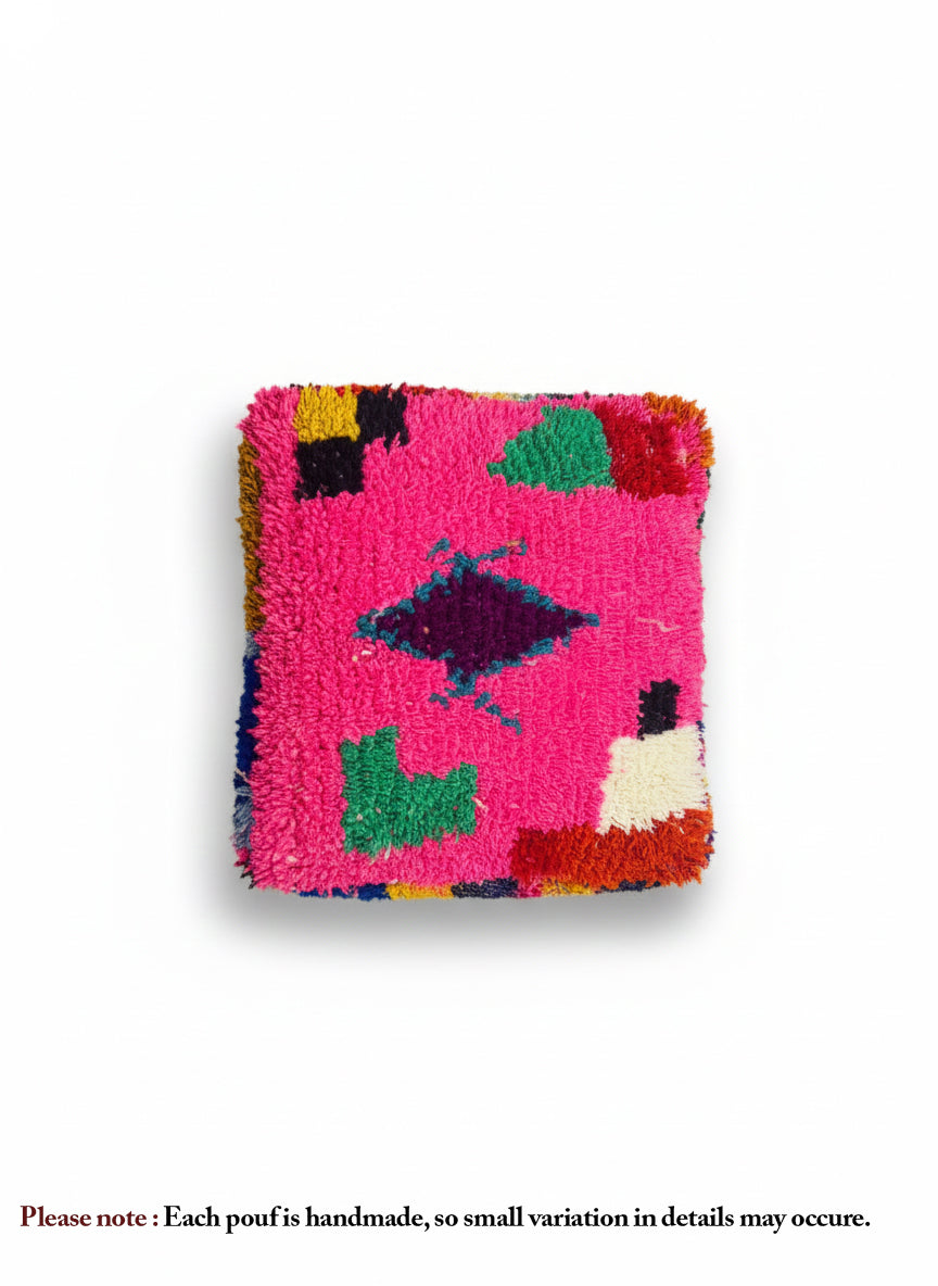 Top view of the vibrant fuchsia Berber Mazin pouf.