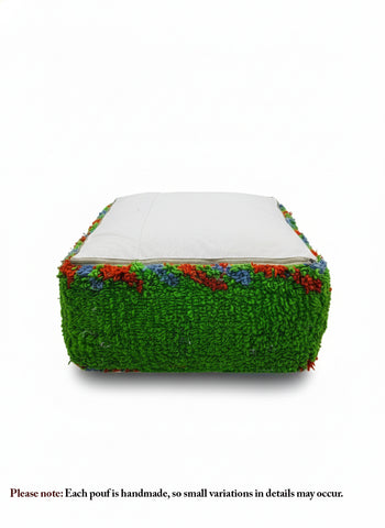 Bottom view of green Berber pouffe with white cotton backing and zipper.