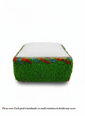 Bottom view of green Berber pouffe with white cotton backing and zipper.