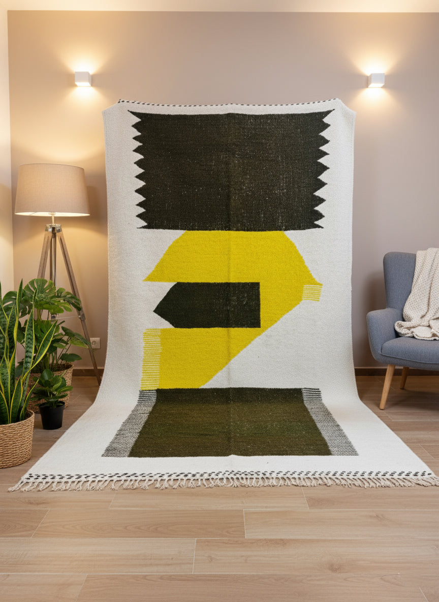 Moroccan Taznurt rug displayed vertically showing bold yellow and olive shapes and fringed edges