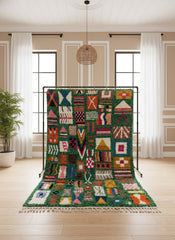 Green Tiloua rug displayed with colorful patterns.