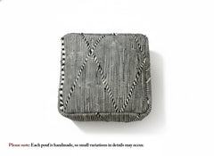 Top view of the black and cream Tamazirt pouf.