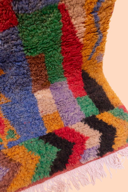 IZZAH Moroccan Rug – Colorful handmade Berber wool rug from Morocco with abstract tribal patterns.