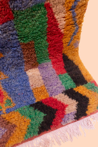 IZZAH Moroccan Rug – Colorful handmade Berber wool rug from Morocco with abstract tribal patterns.