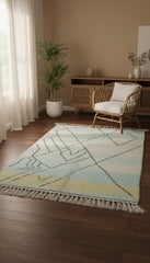 Light blue and yellow Moroccan rug styled in a cozy living room corner.