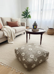 Moroccan floor pouf in cozy living room