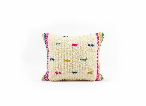 Decorative pillow with colorful patterns on a white background