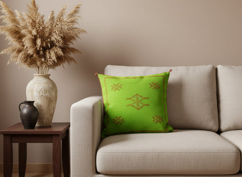 Bright green Moroccan pillow on beige sofa with natural pampas décor