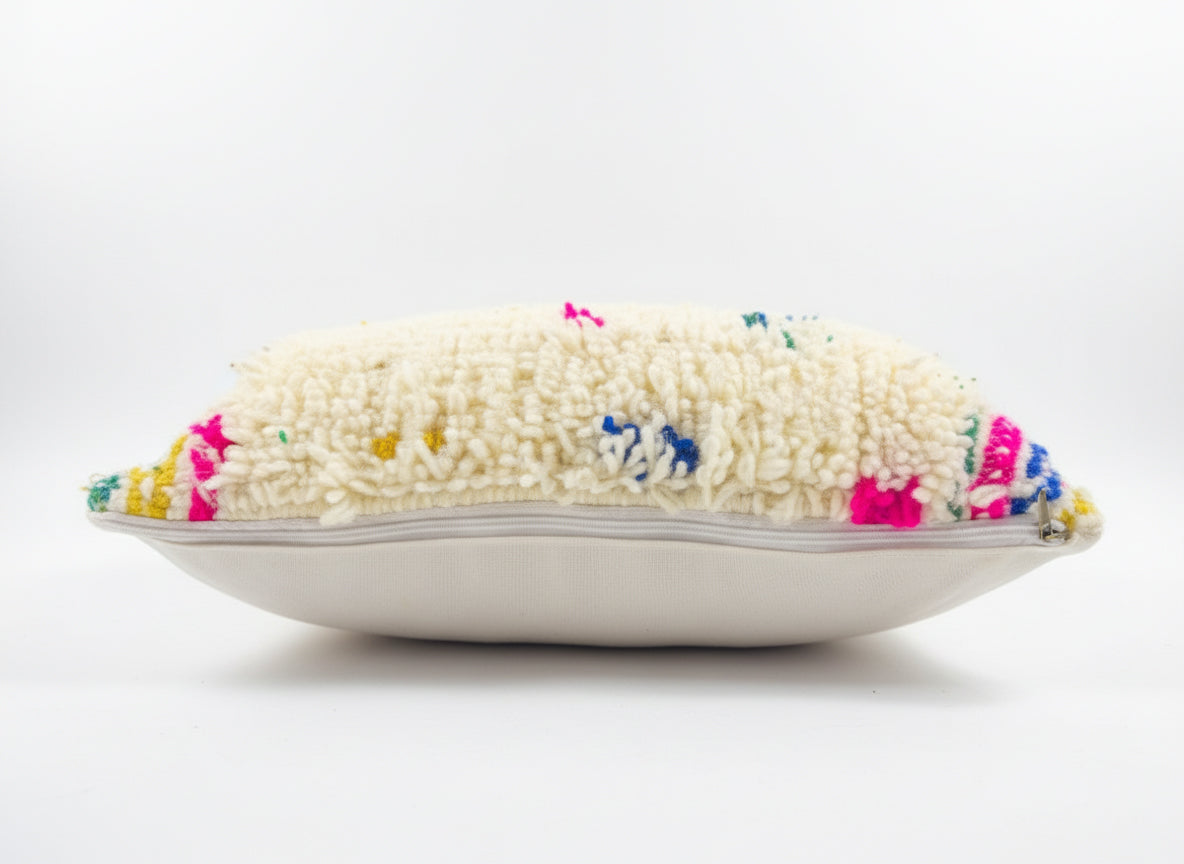 Decorative pillow with colorful embroidered design on a white background