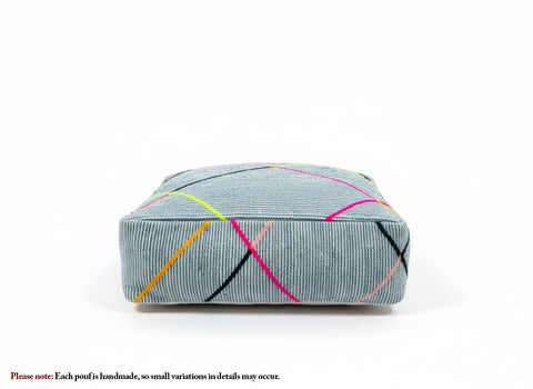Blue Berber pouf with colorful lines, front view