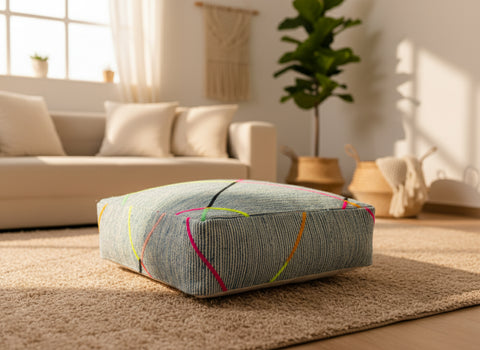 Blue colorful pouf in sunlit living space