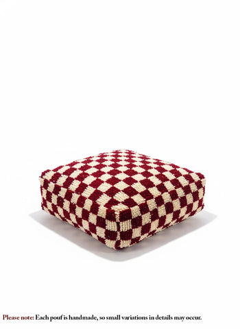 Fuchsia and white checker Berber pouf on clean white studio background