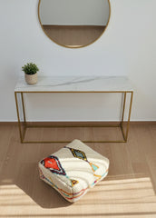 Handwoven Moroccan Berber pouf used as a floor cushion