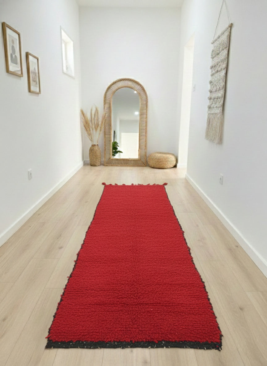 Moroccan Talwit red wool runner rug styled in a minimalist interior