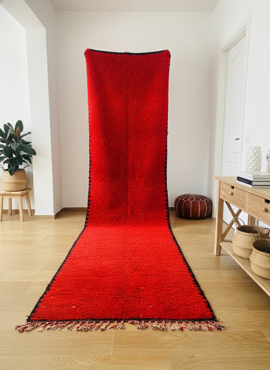 Solid red Moroccan Berber runner rug with traditional black edging