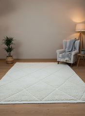 Ivory Berber area rug styled with armchair and floor lamp