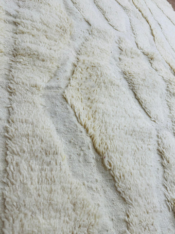 close up photo of the wool beige rug 