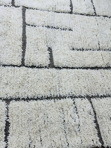 Handmade Tifawin Berber rug with cream wool and black geometric lines