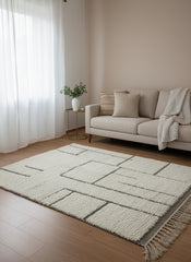 berber beige  rug with gray details in a bright living room 