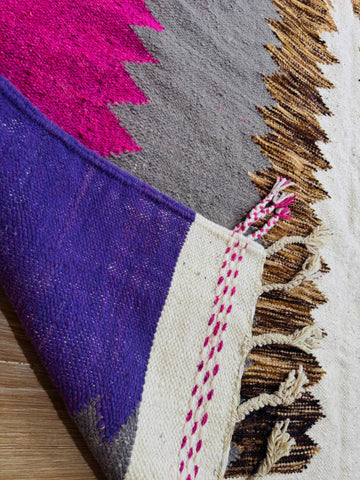 close up photo shows the wool of the rug 