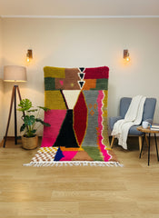 Handwoven Itto Berber wool rug with colorful geometric Moroccan design