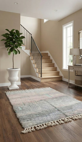 Berber Tifra rug with soft pastel tones placed in a bright modern entryway