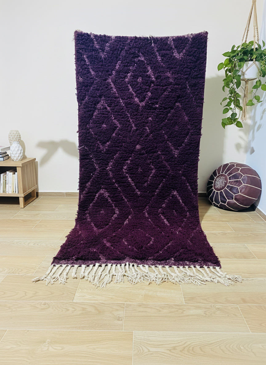 Handwoven purple Berber rug with diamond motifs and fringe