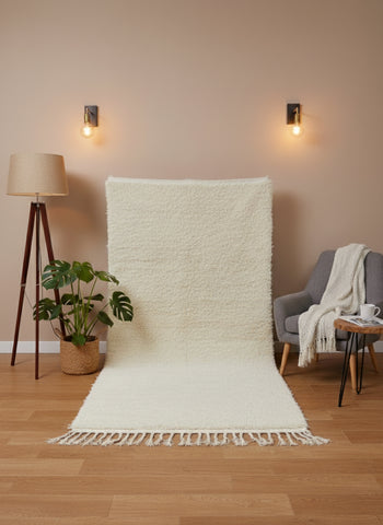 Itriwan beige rug displayed upright with soft texture and tassel edges